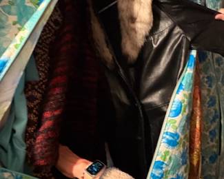 . . . there are a great assortment of women's classic garments -- here is a leather jacket with faux fur collar