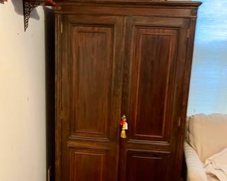 Solid wood Armoire and antique baskets