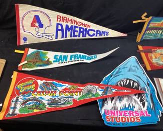 VTG. FELT PENNANTS- CEDAR POINT, BIRMINGHAM AMERICANS, SAN FRANCISCO, UNIVERSAL STUDIOS, MACKINAW CITY, 1986 CLOTH CALENDAR, SMALL BER MUG TUFTED RUG