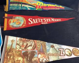 VTG. FELT PENNANTS- CEDAR POINT, BIRMINGHAM AMERICANS, SAN FRANCISCO, UNIVERSAL STUDIOS, MACKINAW CITY, 1986 CLOTH CALENDAR, SMALL BER MUG TUFTED RUG