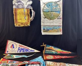 VTG. FELT PENNANTS- CEDAR POINT, BIRMINGHAM AMERICANS, SAN FRANCISCO, UNIVERSAL STUDIOS, MACKINAW CITY, 1986 CLOTH CALENDAR, SMALL BER MUG TUFTED RUG