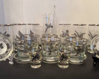 Silver rimmed Vintage Federal Sportsman Glassware
2--shot glasses (ring necked pheasant)
6--lowball glasses (canvasback, Canada goose, ring necked pheasant, and grouse)
8--coasters (2 of each bird)
7--highball glasses (at least one of each bird)
1--cocktail pitcher with stirrer (ring necked pheasant)