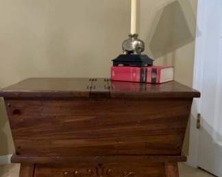 Vintage dough box accent side end table
vintage elephant candlestick lamp and book.