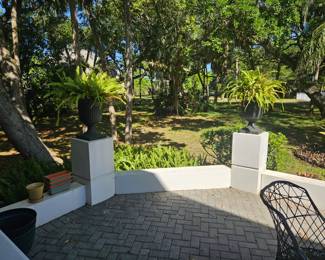 Set of four 24" tall heavy plastic planter urns
$45 each