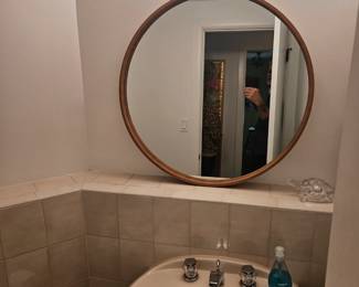 Mid century inspired round wooden rimmed mirror 
$49
Hearth and hand