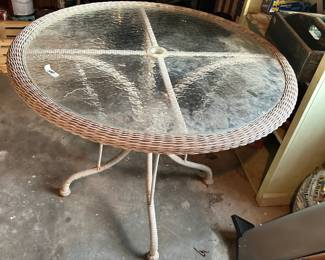 #187 Glass top table wicker trimmed 38x30 $24.00