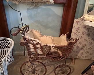 #148 Brown wicker baby pram with umbrella. 27 x 40 inches tall $65.00
