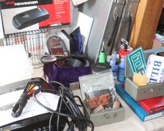 DVD's, VHS table, vintage game console, VHS rewinders, projector