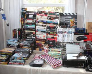 vhs tapes and dvds, projector, cd's cash box 
