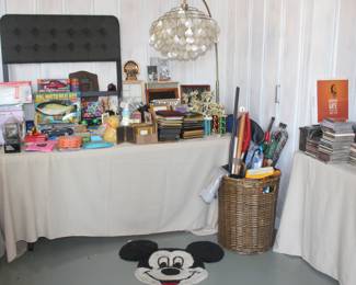 big mouth billy bass, circus tickets, CS Series scale, cards against humanity, vintage photo frames, toy cars, puzzles, Warhol crayons, Frisbee, umbrellas, brooms, shovel, paint rollers, rubber ducky 
