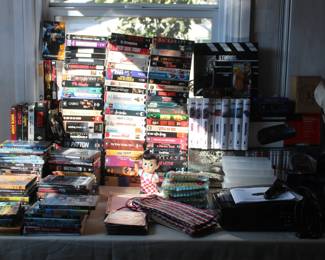DVD's, VHS table, vintage game console, VHS rewinders