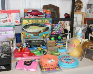 big mouth billy bass, circus tickets, CS Series scale, cards against humanity, vintage photo frames, toy cars, puzzles, Warhol crayons, Frisbee 