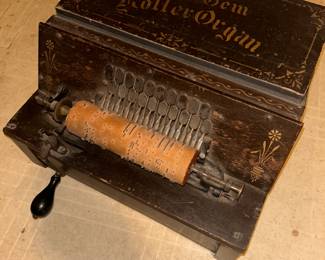 This is a great musical instrument called “The Gem Roller Organ”.