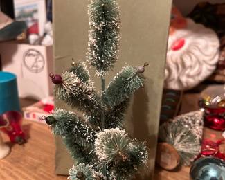 1930s pre-World War II wood base, feather branch Christmas tree - I believe all the glass ornaments at the tip of each branch are still there.
