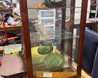 Tabletop cherry curio cabinet with 3 glass shelves.