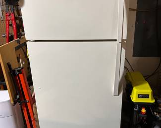 Kenmore refrigerator with freezer on top.