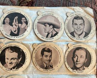 1930s - 1940s movie star lids showing the actor, the movie name and the movie company.