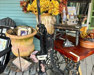 ANTIQUE WATER PUMP, ANTIQUE SEWING TREADLE. WRAP-AROUND PORCH PACKED FULL.