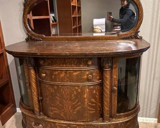 Ornate wooden cabinet with mirror