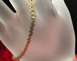 #121 - $1,250 - 7' tennis bracelet - 2 1/2 - 3 cts diamonds on 14kt yellow gold. 10.6 gr.