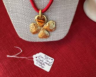 2. Vintage Yves St. Laurent trefle pendant, adjustable $340