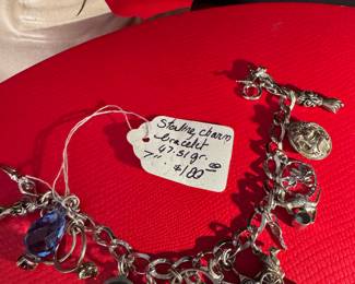 #40 - $100 - Sterling charm bracelet 47.51 gr. 7"