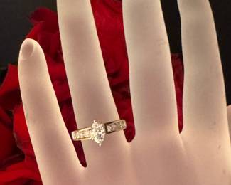 #105- $1500 - 1 ctw ring (1/2 ct marquise) 14kt yellow gold 4.01 grams. Size 7.