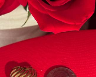 18. $150 - 14kt gold heart locket 