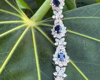 #146 - Wonderful 14kt white gold lady's bracelet with a concealed clasp. bracelet features nine (9) natural blue sapphire. 7 1/4" long. see appraisal for details carats. Price upon request.  
