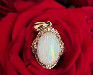 #25 - 14kt gold pendant & oval opal, bezed with diamonds. $980. Appraisal included with purchase. 