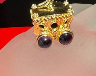 #120 - 18kt yellow gold Carriage charm. 11.6 grwith cabochon (4) amethyst  - $880