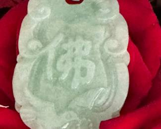 #165 -$328 - Jade pendant carved on both sides. Appraised by Bere. Appraisal will convey to buyer. Approx 1 1/2 x 3' 