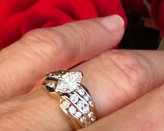 #31 - 1 carat center diamond Marquise cut with small round diamonds 3 rows on 14kt yellow gold. $2,500. 