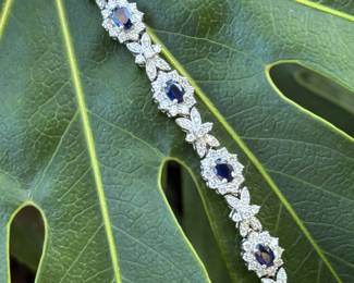 #146 - Wonderful 14kt white gold lady's bracelet with a concealed clasp. bracelet features nine (9) natural blue sapphire. 7 1/4" long. see appraisal for details carats. Price upon request.  