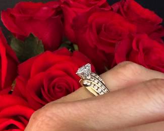 #31 - 1 carat center diamond Marquise cut with small round diamonds 3 rows on 14kt yellow gold. $2,500. 