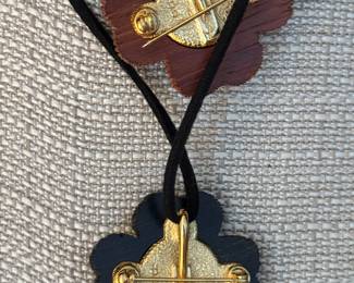 5 & 6. Yves St Laurent Brown or Black Clover Pendant w/rhinestones. $180 each 