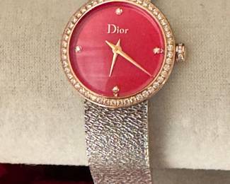 #132 - Lady dior "D" watch - bracelet is stainless steel red face. stainless steel. diamond bezel.  $2950.