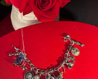 #40 - $100 - Sterling charm bracelet 47.51 gr. 7"