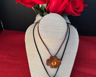 5 & 6. Yves St Laurent Brown or Black Clover Pendant w/rhinestones. $180 each 