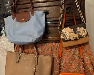 Mikael Kors & Longchamps purses. 