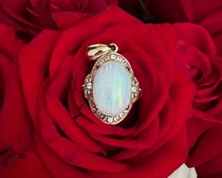 #25 - 14kt gold pendant & oval opal, bezed with diamonds. $980. Appraisal included with purchase. 