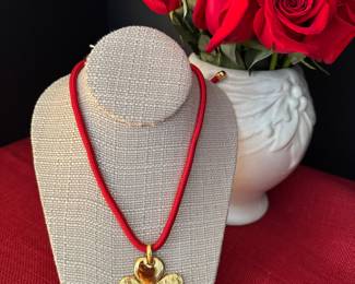 2. Vintage Yves St. Laurent trefle pendant, adjustable $340