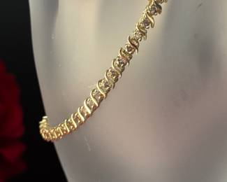#119 - $1000 - 7 1/2" tennis bracelet 2 ctw diamonds , 14kt ywllow gold 8,9 gr. 