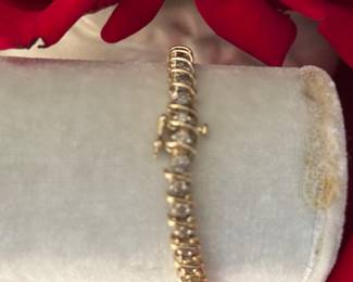 #123 - 7" tennis bracelet - 4 ctw of diamonds on 14kt yellow gold setting. 18.7 gr. $1550 