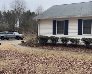 850 front of home, left front corner and driveway