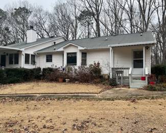 back of home, small porch area