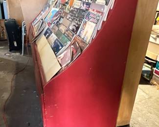 I have 2 of these red book displays.  4 drawers underneath that slide easily.  Solid wood. 4 ft x 2 ft. x 57 inches long.  $150 each.  Currently painted red. reduced to $50 each 