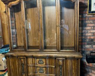 The china hutch is currently in the front entrance.  We have since put the glass shelves all back inside.  There's lights and lots of storage beneath.  Comes in 2 pieces. $250 reduced to &150