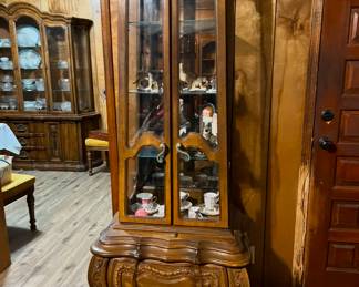 tall narrow hutch by the front doorway.  $100 Has 2 drawers for storage. Very ornate.
