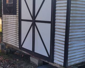 Leonard all metal shed with metal seamless roof and a double door